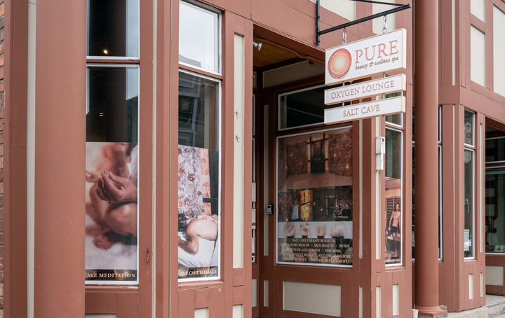 front exterior of pure beauty & wellness spa in telluride, colorado with windows and signage