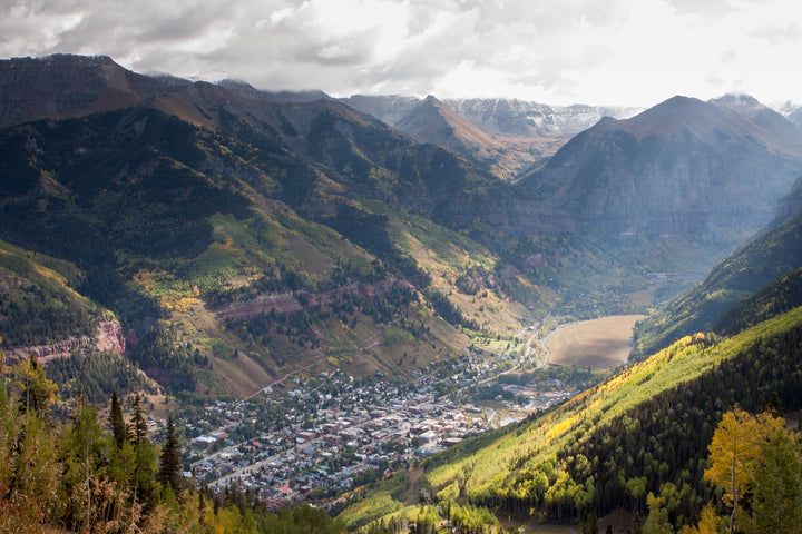a birds eye view of downtown telluride and the surrounding mountains