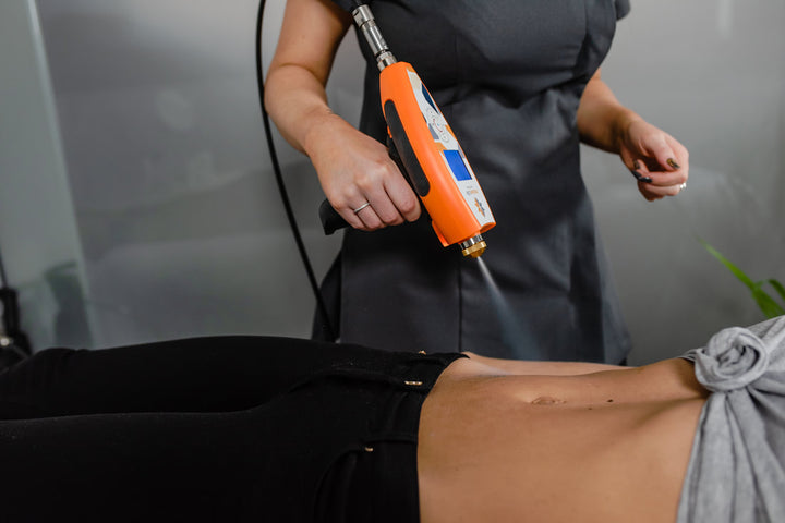 woman doing cryotherapy treatment to a patient